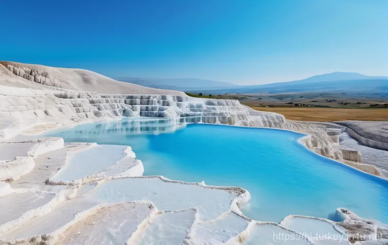 튀르키예의 유명한 온천 지역 - **Image Prompt 1: Pamukkale's Cotton Castle Serenity**
    A wide shot capturing the breathtaking, m...